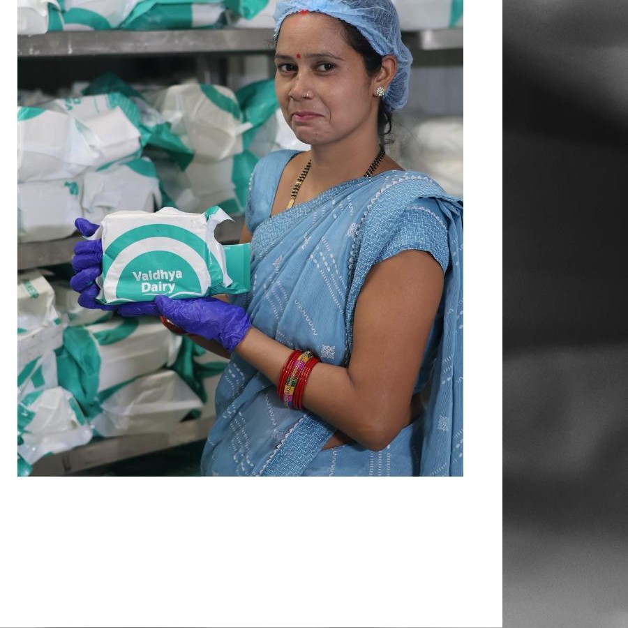 Team member handling packed paneer
